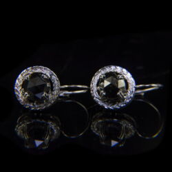 Picture 2/4 -A pair of gold earrings with a leverback closure and black diamonds