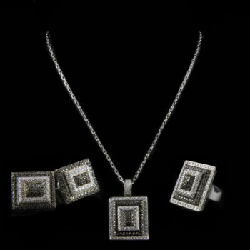 White gold jewellery set with brilliant-cut white and black diamonds