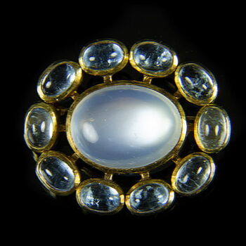 Gold brooch with moonstone and aquamarines