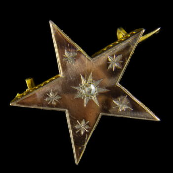 Star-shaped golden brooch