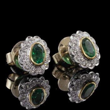 Rosette-style emerald earrings with a pair of diamonds