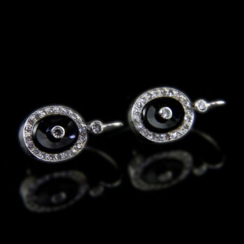 A pair of rosetta-style onyx-diamond earrings