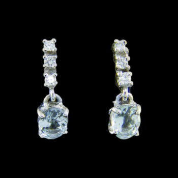 A pair of stud earrings with aquamarine and diamonds