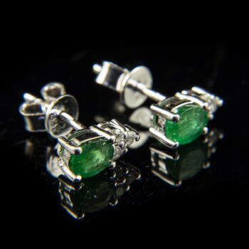 Stud-style emerald earrings with diamonds