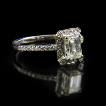 White gold ring with an emerald-cut diamond