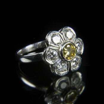 14 K rosetta style white gold and diamond ring