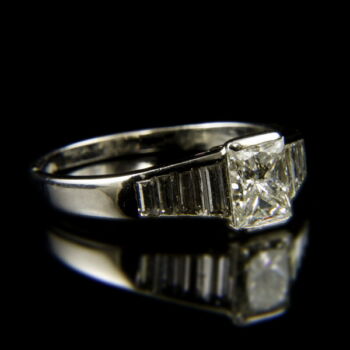 Solitaire white gold ring with a princess-cut diamond