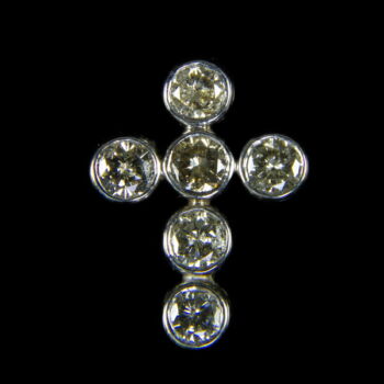 Cross-shaped pendant with diamonds