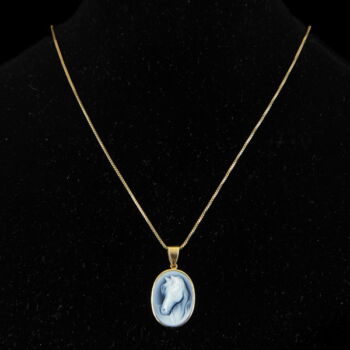 Blue agate cameo with a horse's head hanging on a gold chain