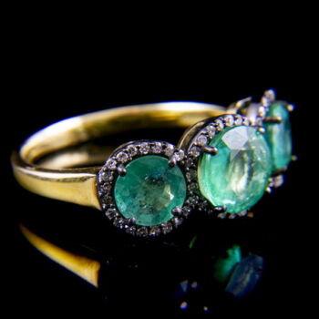 Alliance-style emerald diamond ring