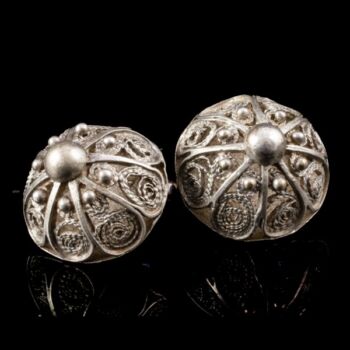 Pair of openwork silver decorative buttons