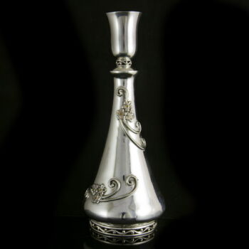 Silver liquor bottle with a small glass