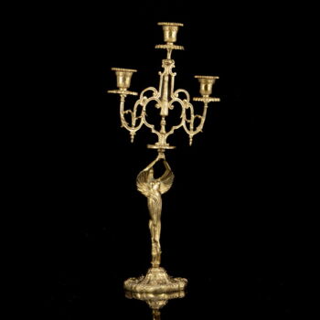 Three-arm brass figural candlestick