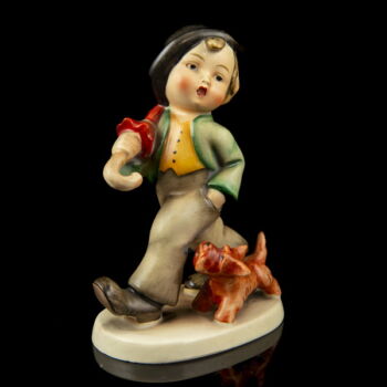 Hummel " Strolling along" figurine - a boy with an umbrella walking his dog