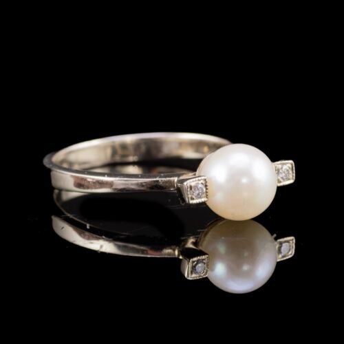 Gyűrű gyönggyel és apró brillekkel