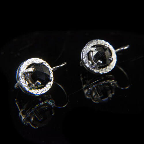 A pair of gold earrings with a leverback closure and black diamonds