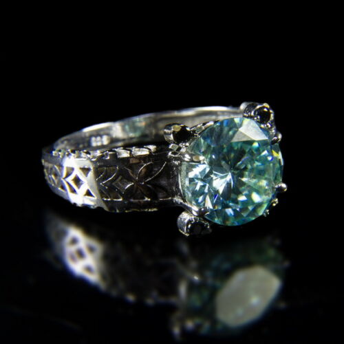 Solitaire ring with blue moissanite stone