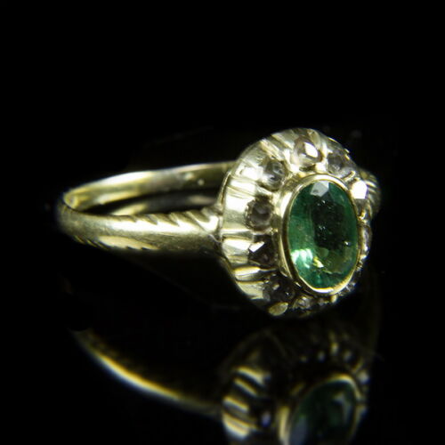 Rosetta-style women's gold ring with emerald and diamonds