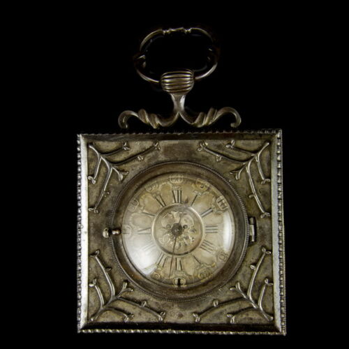 Clock installation in an iron case with an antique British pocket watch. John Holmes London