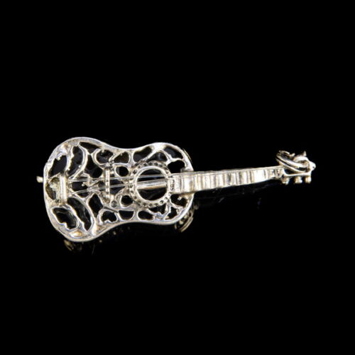 Silver openwork guitar