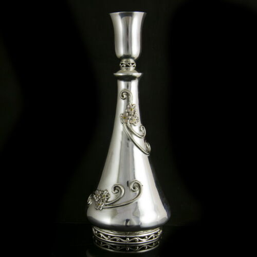 Silver liquor bottle with a small glass