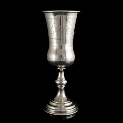 Silver cup with a base and a decorated mantle