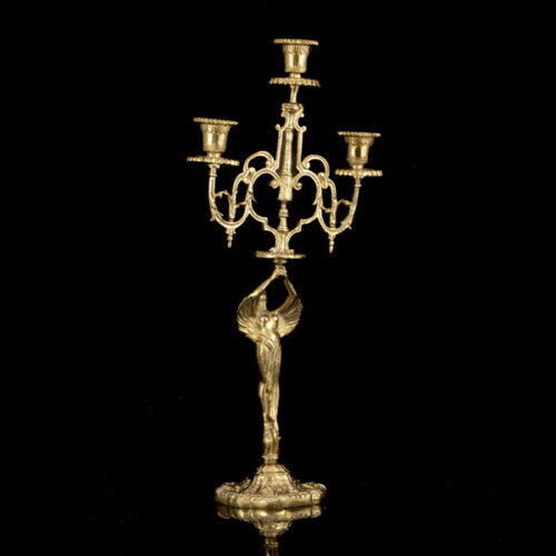 Three-arm brass figural candlestick